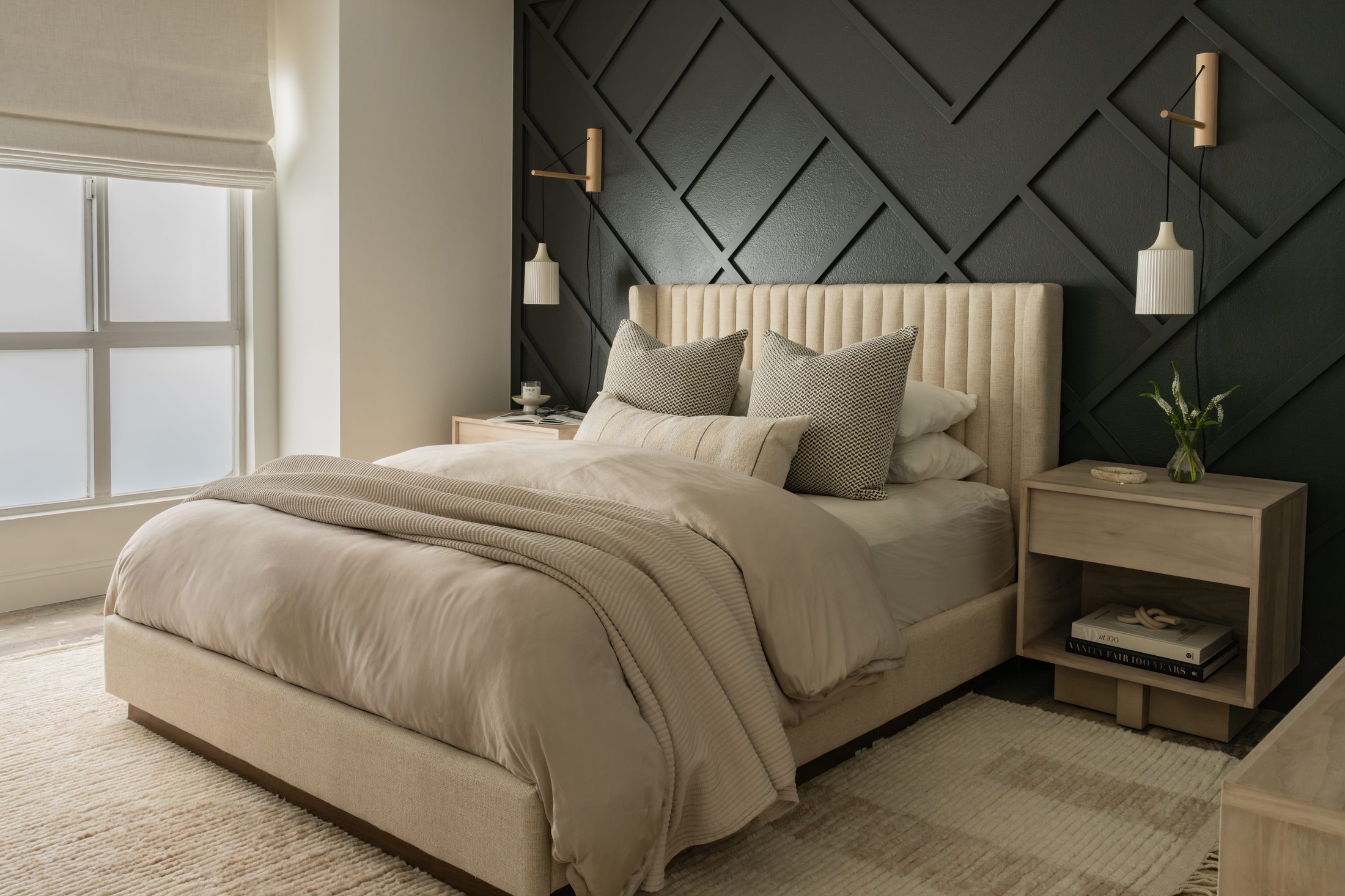 Laguna Beach bedroom interior with dark accent wall