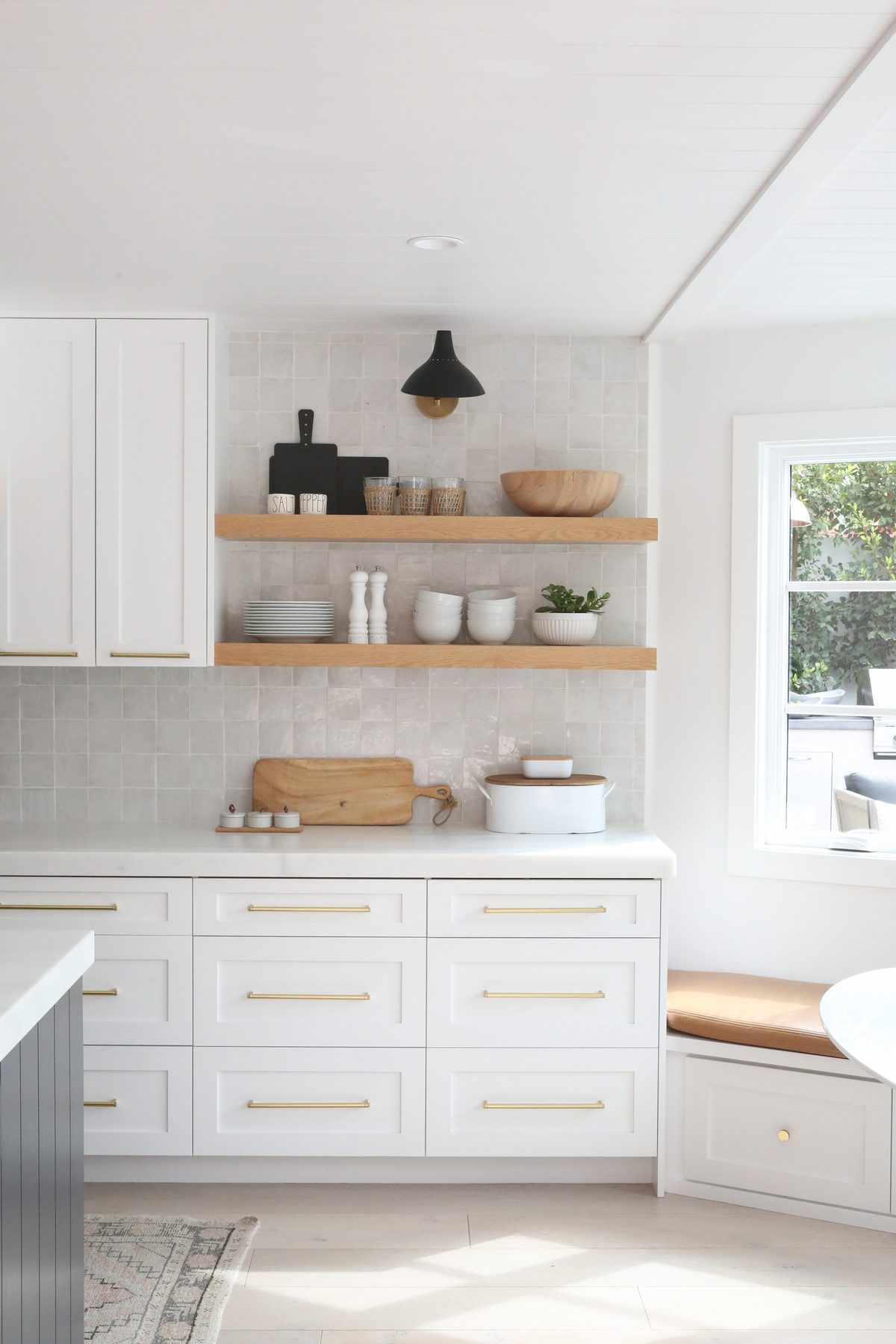 Installed kitchen cabinetry with floating shelves