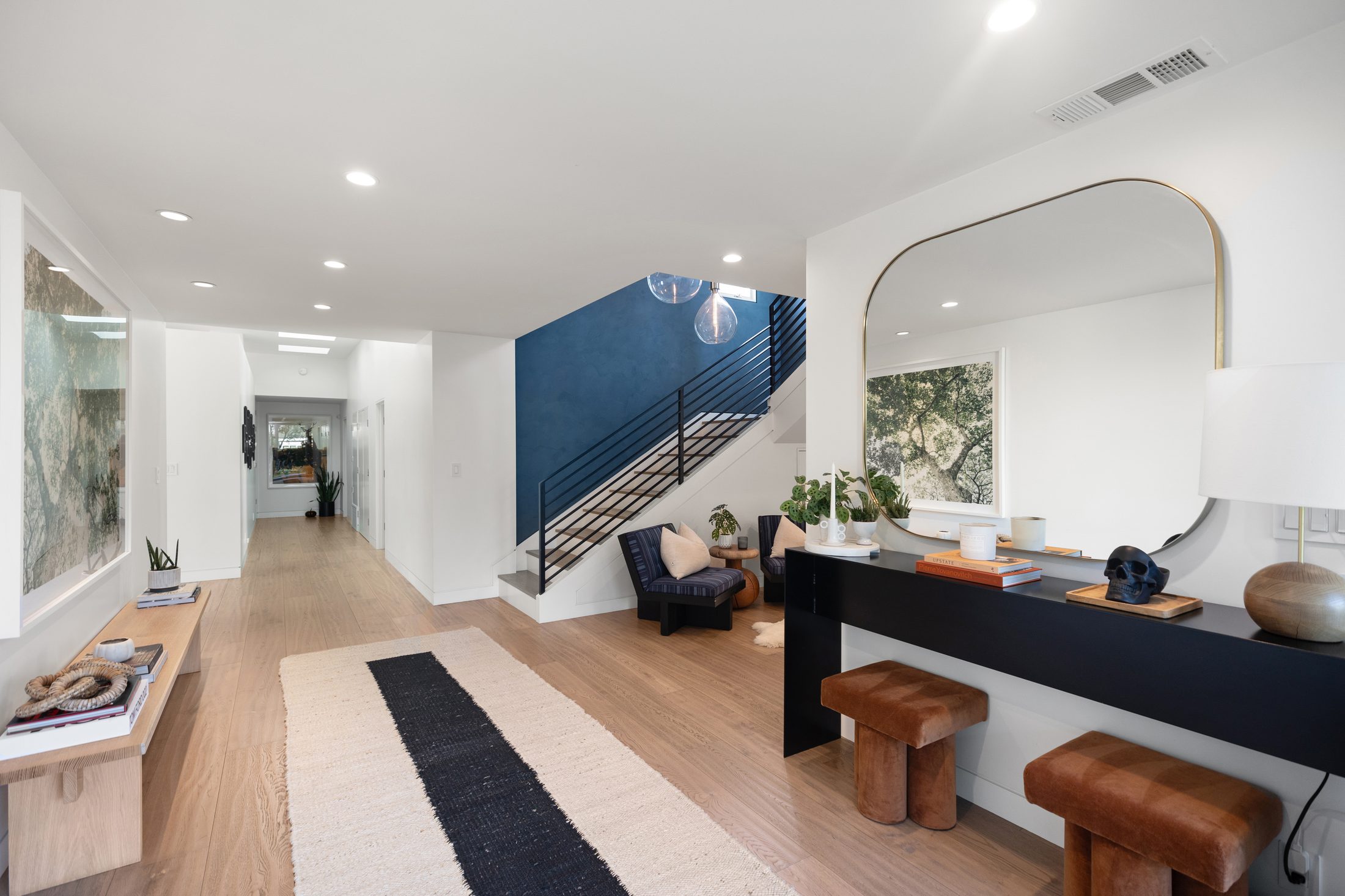 Entry hall of a custom Shipwright Homes residence with dark accent wall